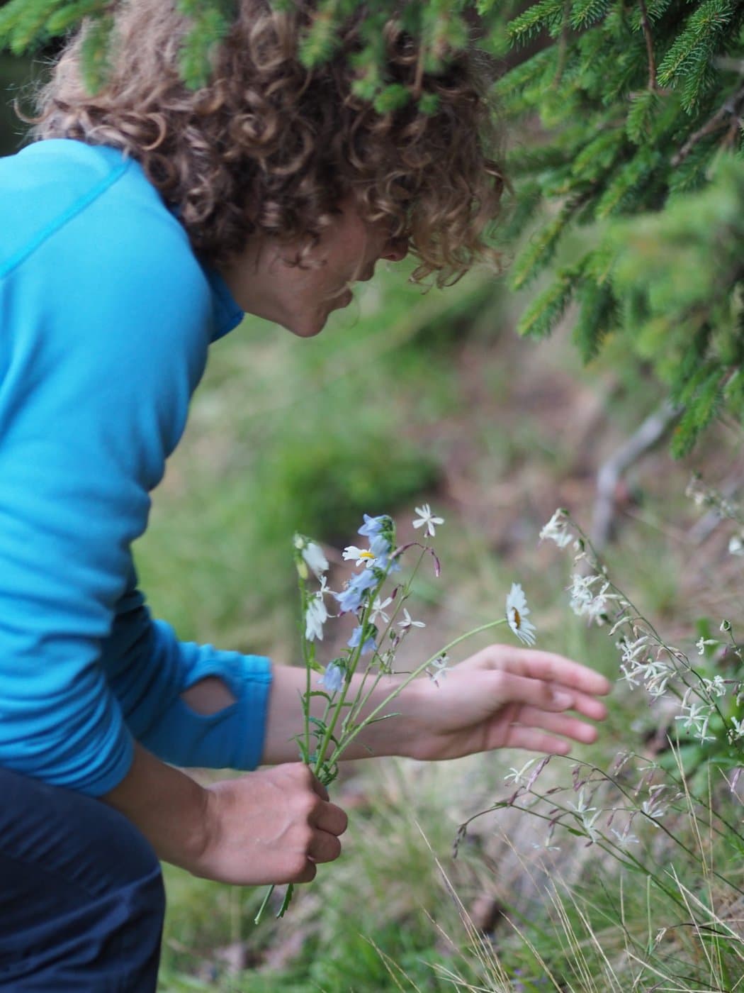 Sandrine picking wildflowers in Mürren
